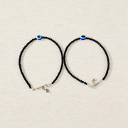 Elegant anklet with blue evil eye charm for girls and women, featuring adjustable chain and delicate bead detailing, designed for protection and style