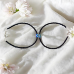 Elegant anklet with blue evil eye charm for girls and women, featuring adjustable chain and delicate bead detailing, designed for protection and style