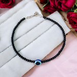 Elegant anklet with blue evil eye charm for girls and women, featuring adjustable chain and delicate bead detailing, designed for protection and style