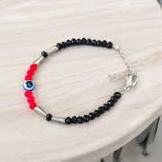 Evil Eye Anklet for Kids featuring black and red beads with stretchable design, ideal for daily wear and spiritual protection