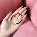 Evil Eye Anklet for Kids featuring black and red beads with stretchable design, ideal for daily wear and spiritual protection