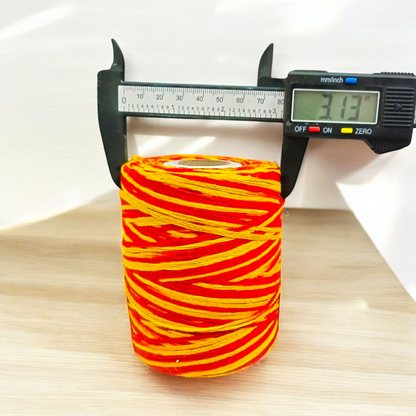 Extra large bundle of red Kalawa Moli thread, neatly rolled, with strands displayed beside for ceremonial use