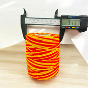 Extra large bundle of red Kalawa Moli thread, neatly rolled, with strands displayed beside for ceremonial use