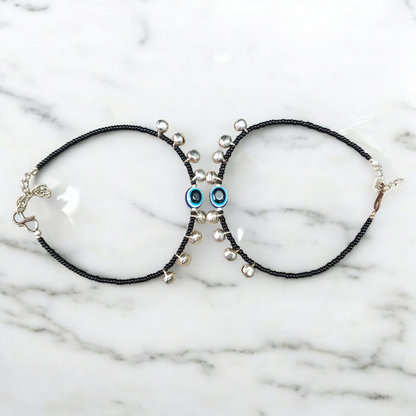 Fancy evil eye anklet for girls with adjustable chain, featuring blue enamel charm and beadwork, ideal for daily wear or special occasions
