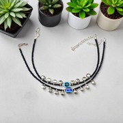 Fancy evil eye anklet for girls with adjustable chain, featuring blue enamel charm and beadwork, ideal for daily wear or special occasions