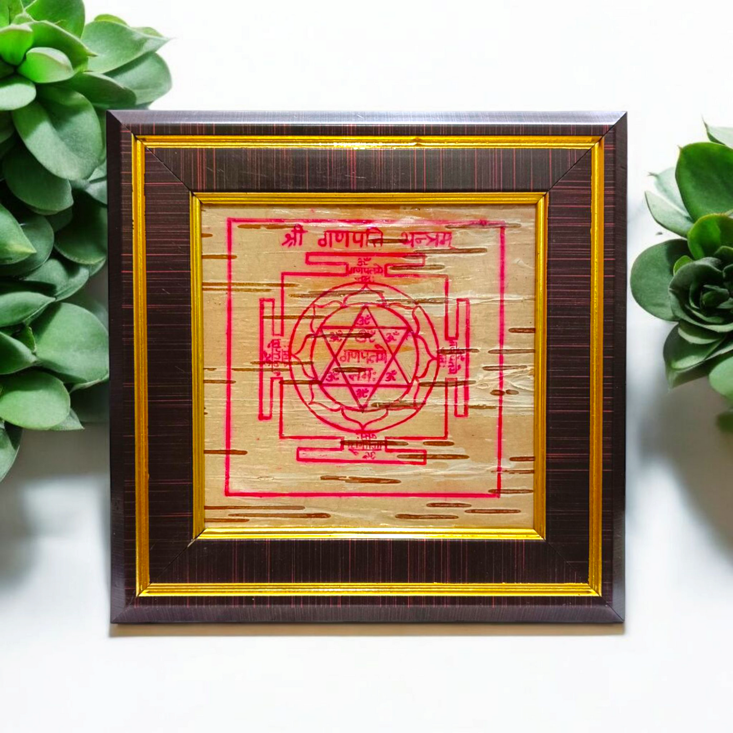 Framed Ganpati Yantra inscribed on natural Bhojpatra, with sacred symbols and wooden casing for display