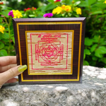 Framed Ganpati Yantra inscribed on natural Bhojpatra, with sacred symbols and wooden casing for display