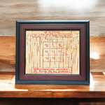 Framed Ketu Yantra hand-inscribed on natural Bhojpatra with red ink, enclosed in a wooden frame for pooja and astrology remedies