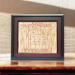 Framed Ketu Yantra hand-inscribed on natural Bhojpatra with red ink, enclosed in a wooden frame for pooja and astrology remedies