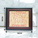 Framed Ketu Yantra hand-inscribed on natural Bhojpatra with red ink, enclosed in a wooden frame for pooja and astrology remedies