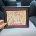 Framed Ketu Yantra hand-inscribed on natural Bhojpatra with red ink, enclosed in a wooden frame for pooja and astrology remedies