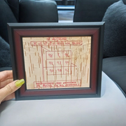 Framed Ketu Yantra hand-inscribed on natural Bhojpatra with red ink, enclosed in a wooden frame for pooja and astrology remedies