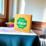 Golden-brown Labhganga Gold Loban resin pieces in a pouch, ready for hawan and pooja rituals