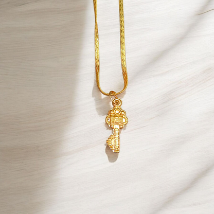 Golden Kuber Kunji locket with matching chain, designed for daily wear and believed to attract wealth and prosperity