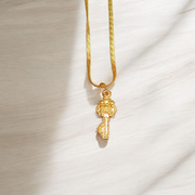 Golden Kuber Kunji locket with matching chain, designed for daily wear and believed to attract wealth and prosperity