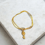 Golden Kuber Kunji locket with matching chain, designed for daily wear and believed to attract wealth and prosperity