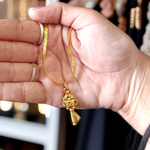 Golden Kuber Kunji locket with matching chain, designed for daily wear and believed to attract wealth and prosperity