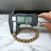 Golden Pyrite Bracelet made with polished 8mm beads, stretchable design for daily wear and spiritual use