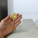 Golden antique-style Kuber Kunji Key with sacred symbols and yantra, used for attracting wealth and financial prosperity at home or office