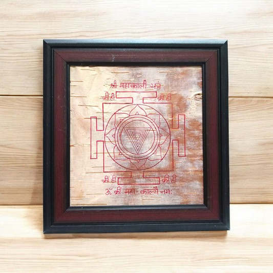Hand-inscribed Mahakali Yantra on Bhojpatra with red ink, enclosed in a wooden frame, ideal for spiritual protection and tantric worship