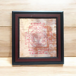 Hand-inscribed Mahakali Yantra on Bhojpatra with red ink, enclosed in a wooden frame, ideal for spiritual protection and tantric worship