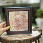 Hand-inscribed Mahakali Yantra on Bhojpatra with red ink, enclosed in a wooden frame, ideal for spiritual protection and tantric worship