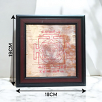 Hand-inscribed Mahakali Yantra on Bhojpatra with red ink, enclosed in a wooden frame, ideal for spiritual protection and tantric worship