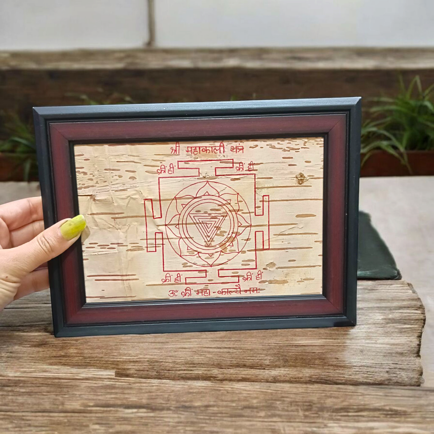 Hand-inscribed Mahakali Yantra on Bhojpatra with red ink, enclosed in a wooden frame, ideal for spiritual protection and tantric worship