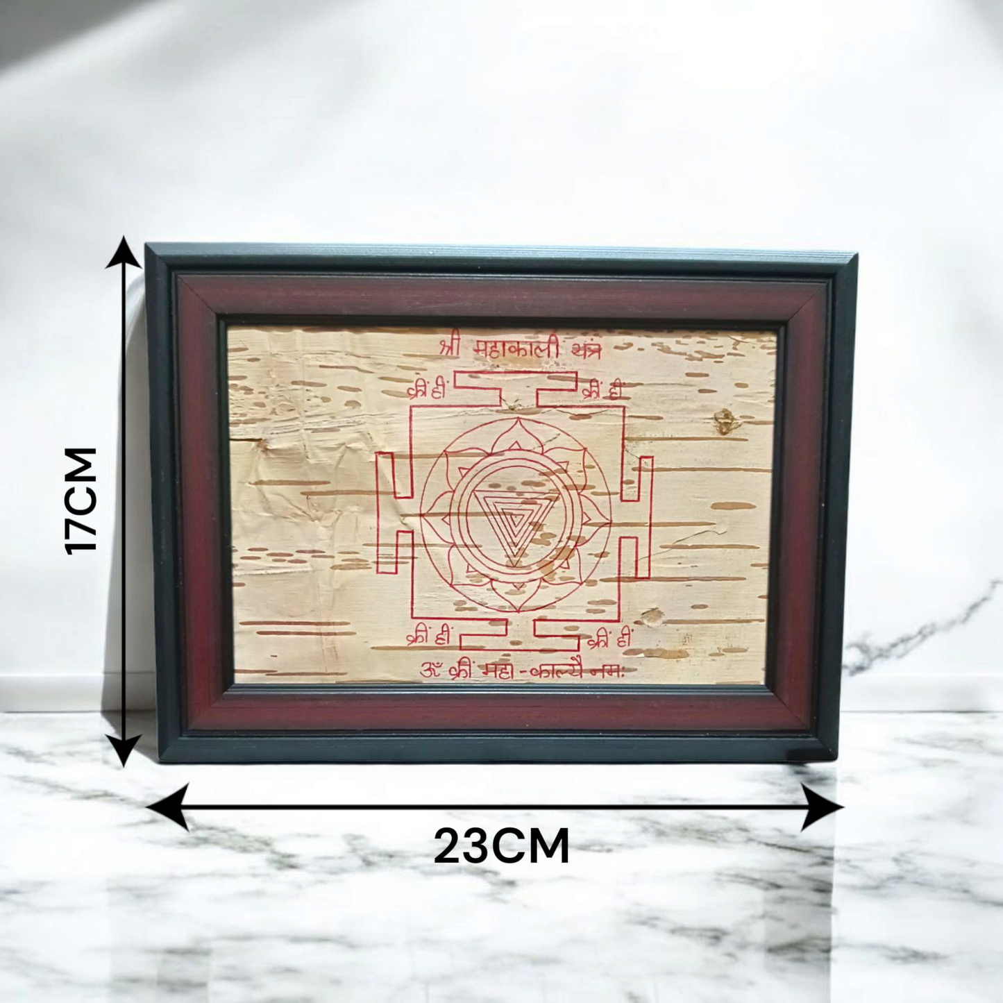 Hand-inscribed Mahakali Yantra on Bhojpatra with red ink, enclosed in a wooden frame, ideal for spiritual protection and tantric worship