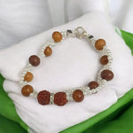 Handcrafted Natural Rudraksha & White Sandalwood Bracelet with 8mm beads on elastic thread, designed for spiritual wellness