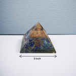 Handcrafted Orgone Pyramid made with natural Lapis Lazuli stones, copper spirals, and resin, designed for energy healing and EMF protection