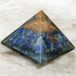 Handcrafted Orgone Pyramid made with natural Lapis Lazuli stones, copper spirals, and resin, designed for energy healing and EMF protection