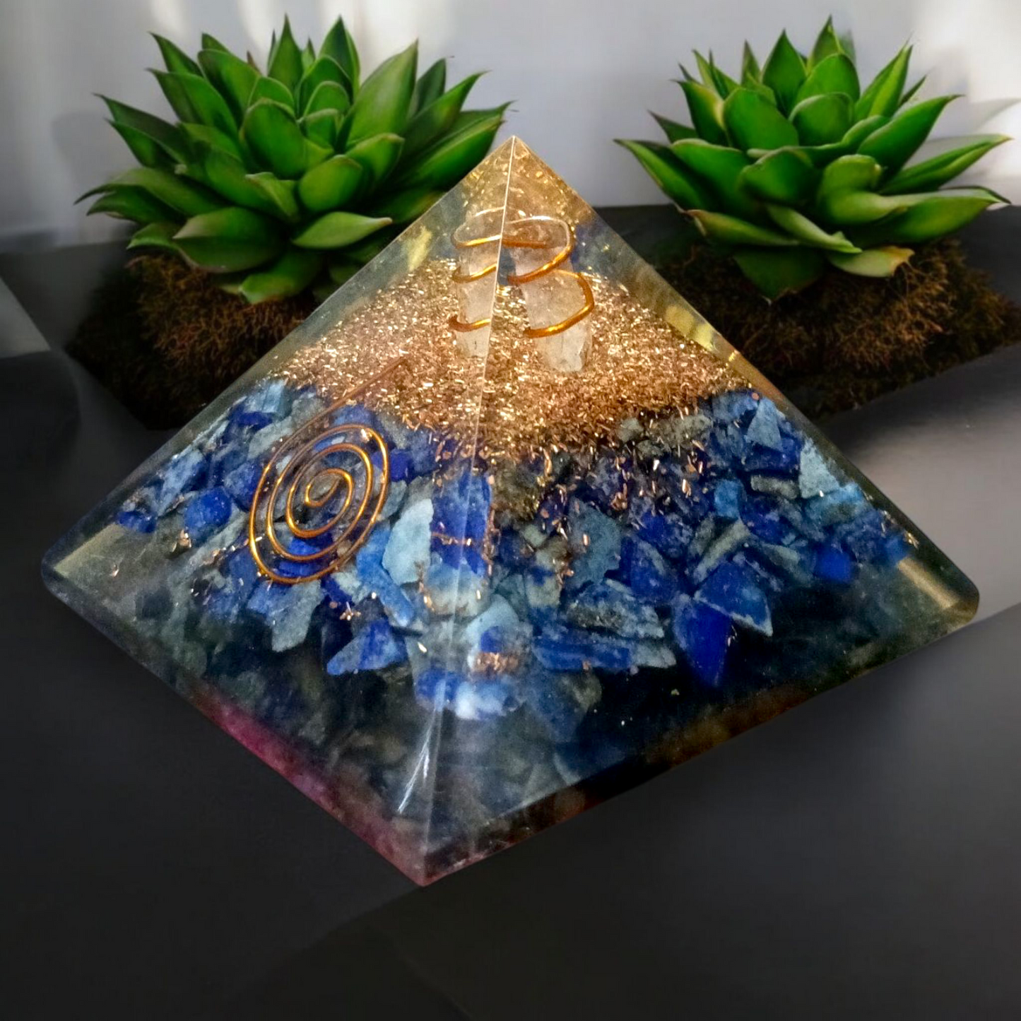 Handcrafted Orgone Pyramid made with natural Lapis Lazuli stones, copper spirals, and resin, designed for energy healing and EMF protection