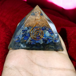 Handcrafted Orgone Pyramid made with natural Lapis Lazuli stones, copper spirals, and resin, designed for energy healing and EMF protection