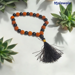 Handcrafted Rudraksha and Black Hakik mala with 5 Mukhi Rudraksha beads, used for protection, grounding, and meditation, available in 27+1 and 108+1 variants