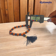 Handcrafted Rudraksha and Black Hakik mala with 5 Mukhi Rudraksha beads, used for protection, grounding, and meditation, available in 27+1 and 108+1 variants