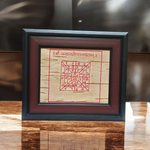 Handmade Santan Gopal Yantra on Bhojpatra enclosed in a wooden frame, used for pregnancy protection and blessings for childbirth