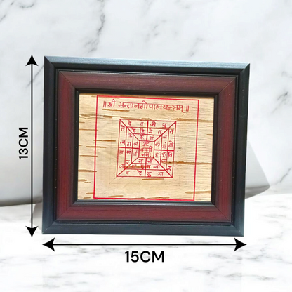 Handmade Santan Gopal Yantra on Bhojpatra enclosed in a wooden frame, used for pregnancy protection and blessings for childbirth