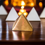 High-quality copper Vastu Pyramid Yantra with detailed etching, placed on a pillar top for energy correction