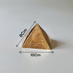 High-quality copper Vastu Pyramid Yantra with detailed etching, placed on a pillar top for energy correction