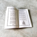 Image of Bhajan Sarover Book in Hindi with vibrant cover and devotional design placed on a wooden prayer table