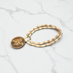 Image of Hanuman Ji Locket strung in Tulsi Mala with natural wood beads, placed on a white background