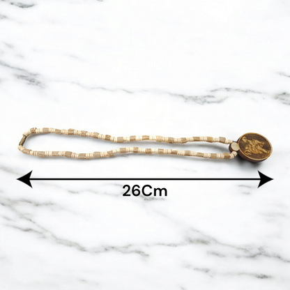 Image of Hanuman Ji Locket strung in Tulsi Mala with natural wood beads, placed on a white background