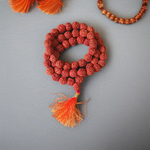 Image of Natural 5 Mukhi Rudraksha Jaap Mala with 54+1 large beads (10-11mm), hand-knotted on red thread, suitable for meditation and chanting