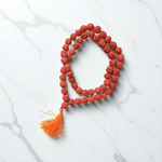 Image of Natural 5 Mukhi Rudraksha Jaap Mala with 54+1 large beads (10-11mm), hand-knotted on red thread, suitable for meditation and chanting