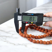 Image of Natural Rudraksha Jaap Mala with 54+1 beads, 8mm size, traditional hand-knotted design, ideal for meditation and chanting