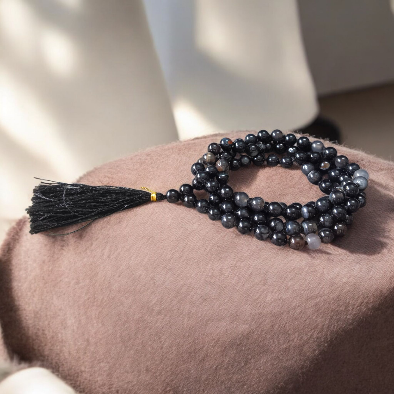 Image of Natural Sulemani Hakik (Black Agate) Mala with 108+1 and 27+1 polished 8mm round beads, displayed on a white background