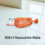 Image of Original Hessonite Garnet Mala with 8mm natural Gomed beads in 108+1 & 27+1 variants, hand-knotted and lab-certified for spiritual use