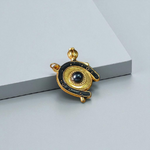 Image of Shani Kavach Set – Brass amulet with black thread placed on a traditional wooden tray with mustard seeds and oil lamp