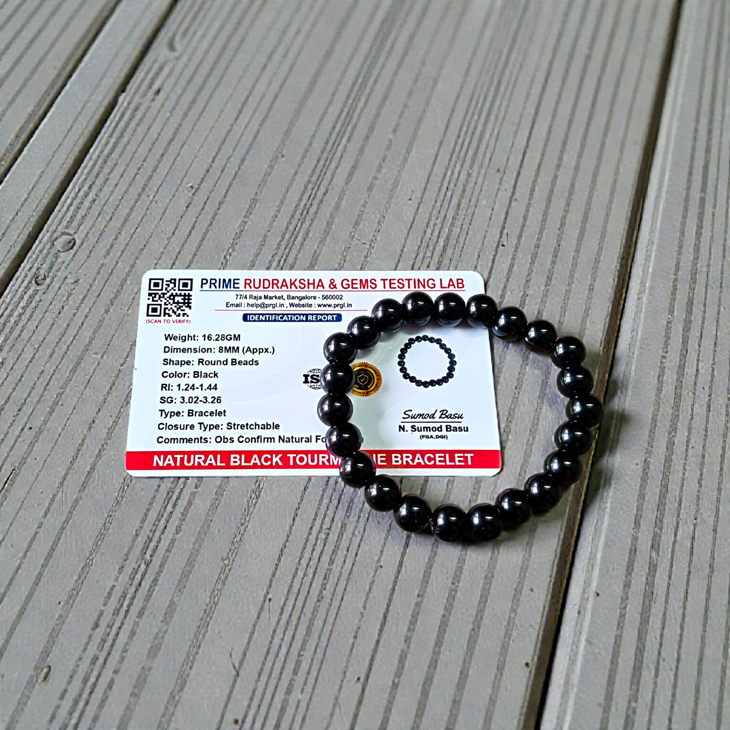 Image of a combo bracelet featuring 8mm golden Pyrite beads and glossy black Obsidian beads arranged side by side on a neutral background